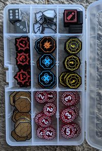 Tokens stored in a plastic bead box
